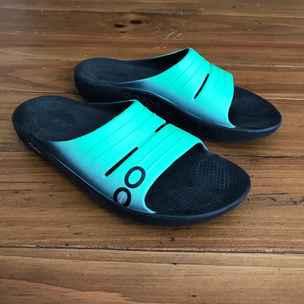 Oofos slide sandals.  Has great support
